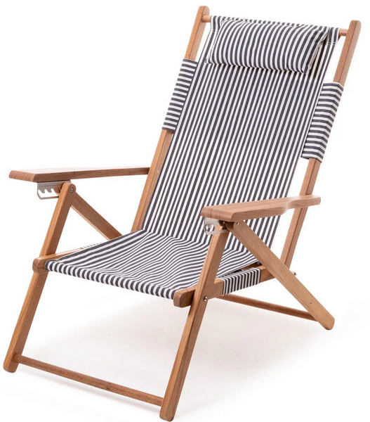 Introducing the Business & Pleasure The Tommy Chair Collection: a wooden-framed reclining beach chair with black and white striped fabric, an adjustable headrest, and an outdoor canvas sling for ultimate relaxation.
