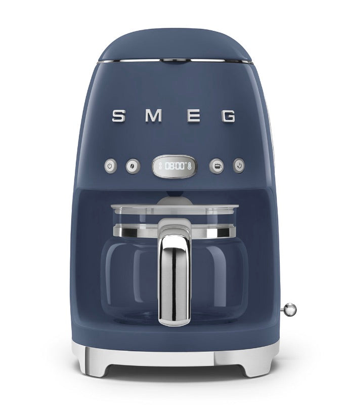 A blue Smeg Drip Filter Coffee Machine from the SMEG collection, boasting a 10-cup capacity, digital clock display, and chrome handle for a modern yet retro design.