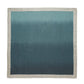 Kim Seybert Dip Dye Napkins feature a square fabric with a gradient from light teal to dark teal, bordered by a thin beige edge, subtly echoing autumn hues.