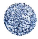 The Kim Seybert Waves White/Navy Placemat features a swirling blue and white abstract design, crafted from hand-poured resin and displayed on a white background.