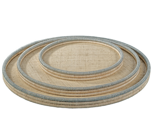 The Zodax La Côte Coiled Round Tray Collection features three nested round trays with light gray edges, stacked together against a white background—ideal for bringing coastal décor charm to your space.