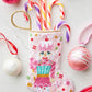 The Sugary Sweet Pink Nutcracker Needle Point Stocking by Bauble Stockings features striped candy canes and pink, white, and red ornaments—perfect festive holiday decor for a white surface.