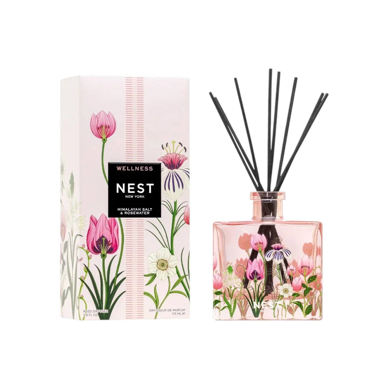 A glass candle and its box, adorned with pink and white floral designs. The label reads “Nest Himalayan Salt & Rosewater Candle Collection,” filling your space with delicate rosewater fragrance and a long-lasting burn time.
