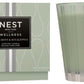 A Nest Wild Mint & Eucalyptus Candle from the Wild Mint & Eucalyptus Candle Collection sits beside its matching light green and silver box, offering an invigorating, spa-like aroma of wild mint and eucalyptus.