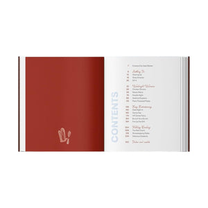 Explore The Newlywed Cookbook by Penguin Random House, featuring an open book with a red page showcasing a utensil illustration on the left and a table of contents highlighting easy meals and section titles with page numbers on the right—ideal for couples or anyone searching for a newlywed cookbook.