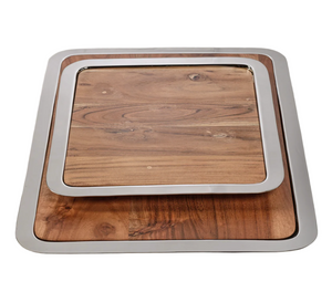 The Brasserie Steel and Acacia Wood Gastronomy Board Collection by Zodax features two stacking rectangular trays with metal rims and natural wood grain, ideal for use as charcuterie or gastronomy boards.