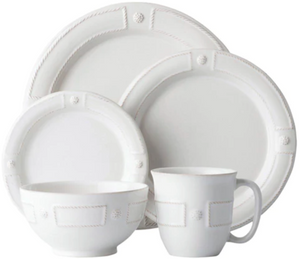 The Juliska Berry & Thread French Panel Dinnerware Collection includes a bowl, mug, salad plate, and dinner plate featuring raised rope and dot details inspired by Parisian architecture along the rims.