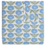 The Kaavia Light Indigo Bedding Collection by John Robshaw features a quilt adorned with a repeating pattern of large blue flowers and green leaves on a white background, evoking the timeless look of classic floral block prints. Shown with one corner folded to reveal the reverse side, this quilt is crafted from soft 200 thread count fabric for exceptional comfort and can also serve as a lightweight duvet for versatile layering.