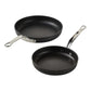 Two Hestan TITUM® Fusion Collection black diamond-reinforced nonstick pans with metal handles are placed on a white background.