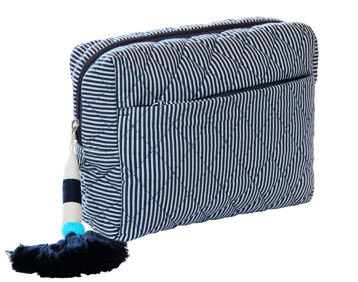 John Robshaw Nandi Quilted Cosmetic Bag in blue and white stripes, featuring a zippered closure and a decorative tassel zipper pull.