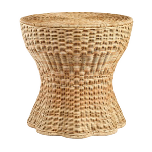 The Made Goods Nevis Side Table showcases a round wicker design with a tapered silhouette, flared base, and woven light brown pattern, shown isolated on a white background.