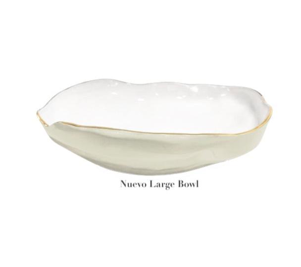 Irregular-rimmed white ceramic bowl with wavy edges from the Encanto Cream Serveware Collection by Beatriz Ball, labeled "Nuevo Large Bowl" underneath.