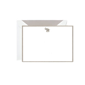 The Crane Elephant Flat Card Set features blank white engraved flat cards with metallic silver borders and a small silver elephant at the top, paired with matching envelopes—ideal for elegant stationery lovers.