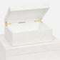 A white, lacquered eggshell rectangular box with a hinged lid open, displaying an empty interior is the Made Goods Della Box, Large.