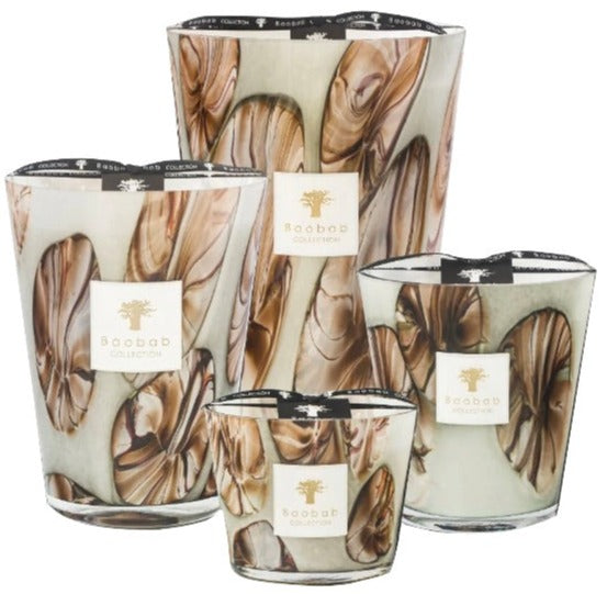 Set of five Baobab Oceania Anangu Collection scented candles with varying heights featuring a swirled brown and white design.