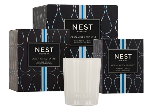 A selection of candles from the NEST Ocean Mist and Sea Salt Candle Collection by Nest, beautifully packaged and featuring the captivating aroma of ocean mist and sea salt.