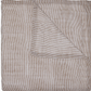 From the John Robshaw Nandi Bedding Collection, a striped cotton quilt is folded at one corner to reveal the reverse, with both sides displaying narrow horizontal and vertical stripes in neutral tones and beautifully hand-quilted for added texture.
