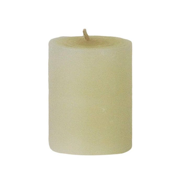 The Votive Candle Set by Perin Mowen features hand-rolled, off-white pillar candles with visible wicks, crafted for a clean burn and artisanal appeal, shown upright against a white background.