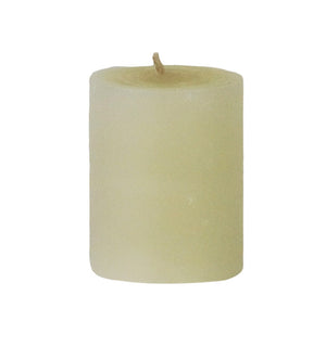The Votive Candle Set by Perin Mowen features hand-rolled, off-white pillar candles with visible wicks, crafted for a clean burn and artisanal appeal, shown upright against a white background.