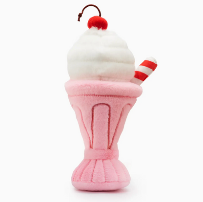 The Foggy Dog Strawberry Milkshake Snuffle Dog Toy is a pink plush milkshake with white whipped cream, a red cherry, and a striped straw—perfect for sweet playtime fun!.