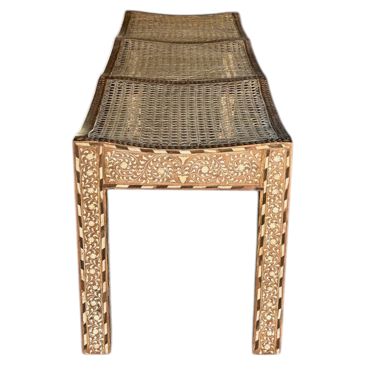 The Bojay Large 3 Seat Cane Bench features detailed carved floral patterns on the legs and sides, a woven cane seat, and a slightly curved design.