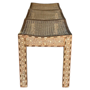 The Bojay Large 3 Seat Cane Bench features detailed carved floral patterns on the legs and sides, a woven cane seat, and a slightly curved design.