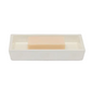 Rectangular Navagio Bath Collection soap dish made of spiraled burl resin, containing a bar of light-colored soap.