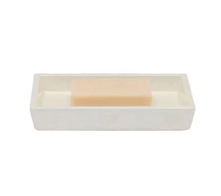 Rectangular Navagio Bath Collection soap dish made of spiraled burl resin, containing a bar of light-colored soap.