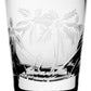 The Palmyra Collection by William Yeoward Crystal features a clear glass tumbler with etched palm trees and grass, inspired by the tranquil landscapes and vibrant marine life of Palmyra Atoll.