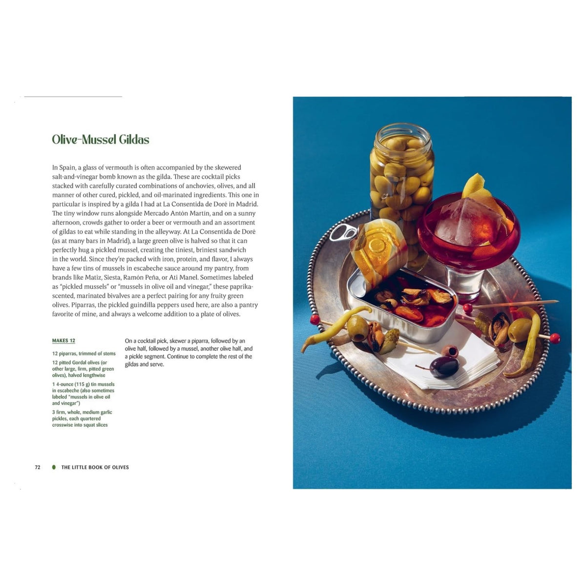 A silver tray with vermouth, green olives, mussels, toothpicks, lemon slice & snail shell—ideal for olive recipes. Recipe from The Little Book of Olives by Abrams shown on the left.