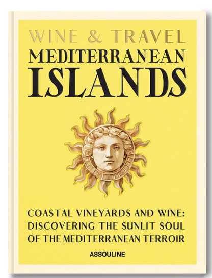 Assouline’s "Wine & Travel Mediterranean Islands" book cover features a sun with a face on a yellow background, with black and gold text highlighting vineyard journeys from Sicilian wines to Greek Assyrtiko discoveries.