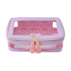 Rectangular lavender and pink Tile Storage Bag by Oh My Mahjong with clear windows, gold zipper, pink tassels, and patterned inner lining. Brand logo on front—stylish way to organize your mahjong set.