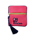 The Pink Coin & Dice Bag by Oh My Mahjong features a strawberry pink zippered pouch with a gold zipper, navy blue tassel, and "OH MY MAHJONG" embroidered on the front—perfect for storing coins or dice in style.