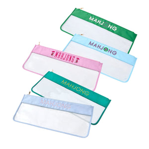 Five Oh My Mahjong "Mahjong Stitched Bag" pouches with colored edges and "MAHJONG" printed on them overlap on a white background—ideal as clear, stylish storage for mahjong tiles.