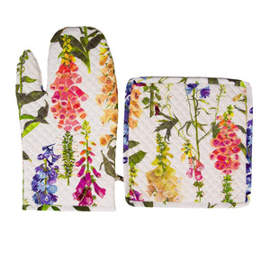 The Caspari Oven Mitt Collection includes a cotton oven mitt and matching pot holder, both featuring colorful floral patterns on a crisp white background.