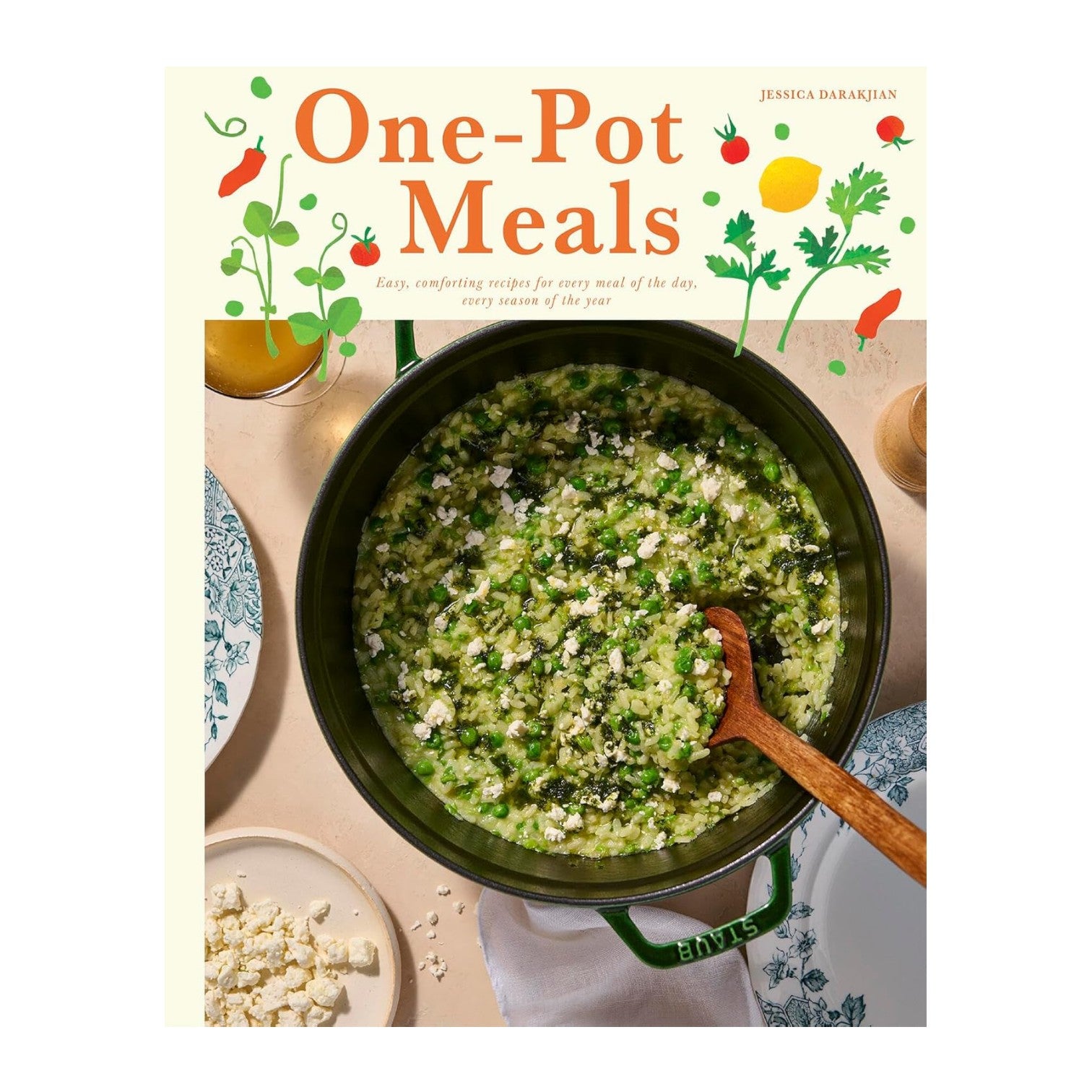 The cover of "One-Pot Meals" by Chronicle Books shows a green vegetable rice dish topped with cheese in a pot, alongside a plate of crumbled cheese and a glass of orange juice—ideal for wholesome dinners.