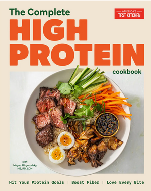 Cover of The Complete High-Protein Cookbook by Penguin Random House, showcasing a bowl filled with beef, eggs, vegetables, and dipping sauce on a light background—your essential resource for high-protein meals and well-balanced meal plans.