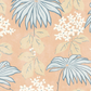 The Bellini Pillow by Hive Custom Pillows features large blue leaves and white flowers with greenish stems on a peach background, crafted with care. Pair it with other custom pieces to elevate any space.