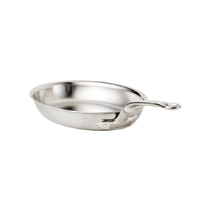 The Hestan Provisions Oval Fish Pan, made of stainless steel with a curved handle, is perfect for preparing whole fish and shown on a white background.