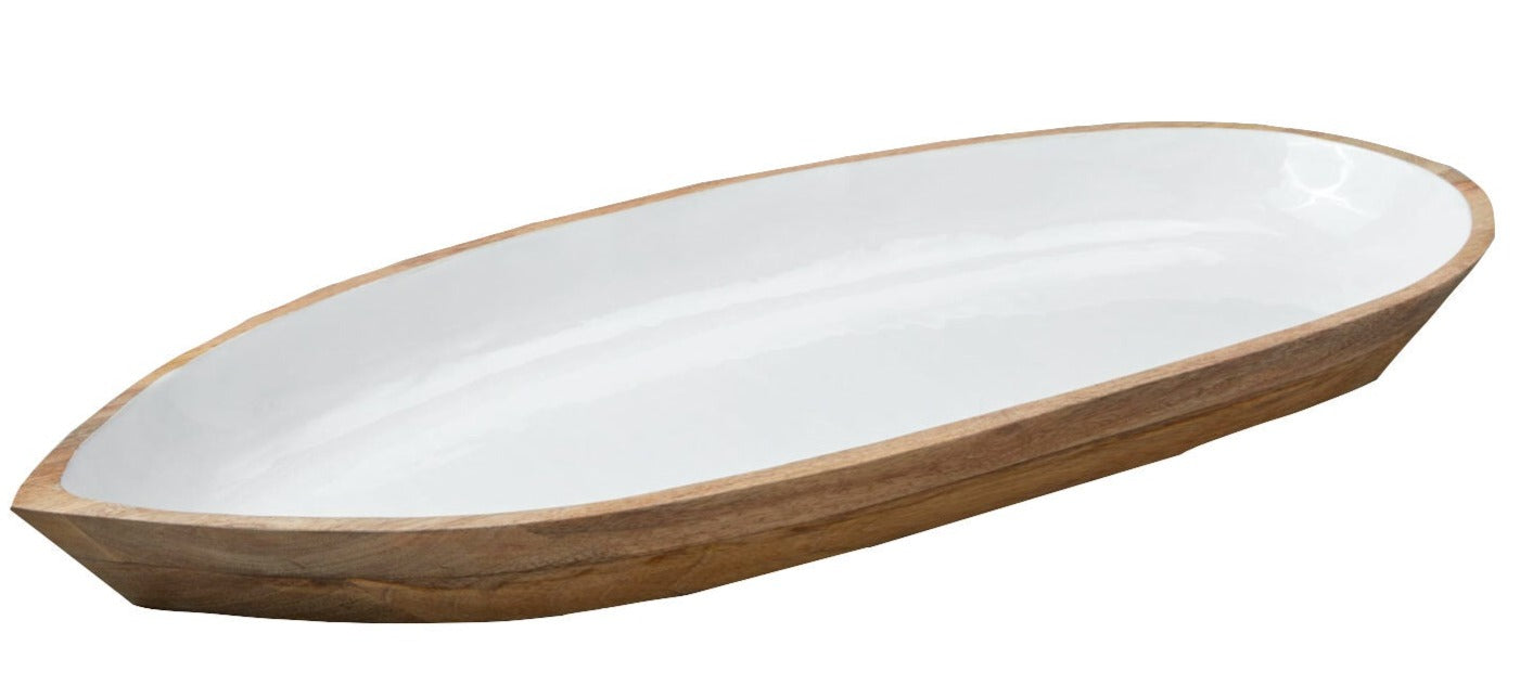 The Madras Oval Dish Collection by Be Home features shallow, elongated oval dishes crafted from sustainably sourced mango wood with a white interior and natural wood exterior.