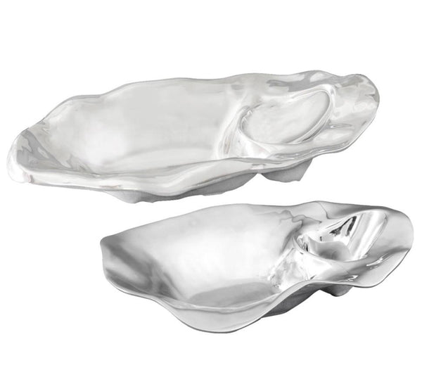 From Beatriz Ball's Ocean Oyster Champagne Bucket Collection, two shiny, irregularly shaped aluminum alloy bowls with smooth, reflective surfaces.