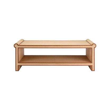 The Matthew Coffee Table by Made Goods features a rectangular raffia design with rounded edges, a unique shape, and an open lower shelf, shown from the front against a white background.