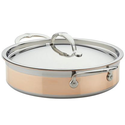The Hestan CopperBond Copper Induction Sauteuse, 3.5qt, is a shallow stainless steel and copper pan with lid and dual handles, designed for induction use and shown against a white background.