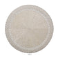The Kim Seybert Palisade Placemat is a round, silver beaded placemat with a textured woven pattern and raised edges, ideal for formal occasions. Shown on a white background.