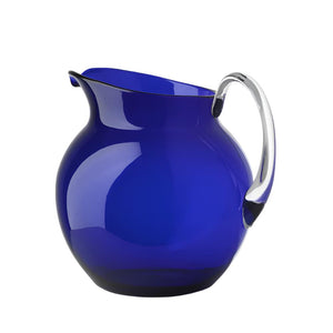 The Mario Luca Giusti Acrylic Palla Pitcher Collection features a round, cobalt blue acrylic pitcher with a clear, curved handle, shown against a plain white background.