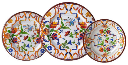 Three plates from the Mario Luca Giusti Pancale White Melamine Dinnerware Collection feature vibrant blue, orange, green, and red floral and butterfly motifs, artfully overlapping each other.