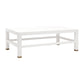The Made Goods Jarin Coffee Table in Designer White Belgian Linen features a textured rectangular design, lower shelf, four legs with brass accents, and a durable faux linen finish.