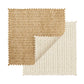 Two fabric swatches with zigzag edges—one brown, one cream—overlap on a white background. The cream swatch’s curled corner highlights the basketweave pattern found in the Kim Seybert Vista Reversible Placemat.