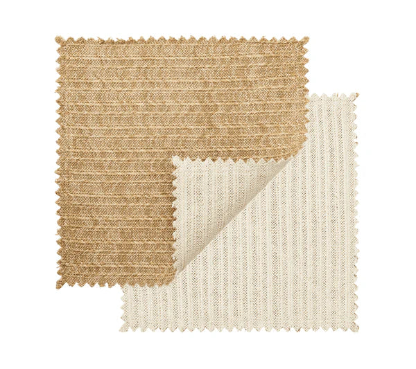 Two fabric swatches with zigzag edges—one brown, one cream—overlap on a white background. The cream swatch’s curled corner highlights the basketweave pattern found in the Kim Seybert Vista Reversible Placemat.