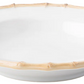 A white, shallow ceramic bowl with a bamboo-inspired rim and raised base adds casual elegance to your table as part of the Juliska Classic Bamboo Dinnerware Collection.